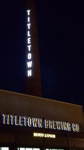 Titletown Brewing sign towering above its Beerworks facility in downtown Green Bay, Wisconsin