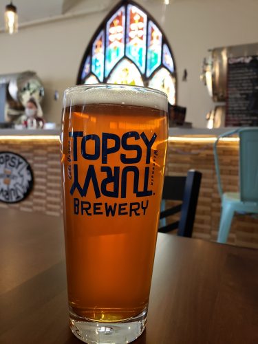 Tap and some stained glass to admire at Topsy Turvy Brewing, Lake Geneva, Wisconsin