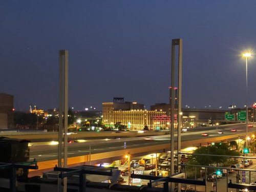 View of Milwaukee, looking southwest from the Central Standard Distillery rooftop. I-794 is in the foreground, Highway 32 crosses below
