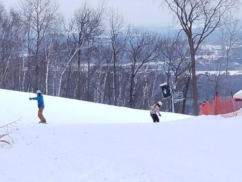 Snowboarding atop Granite Peak Ski Area in Rib Mountain, Wisconsin, above Wausau. Rib Mountain is one of Wisconsin's highest natural points.