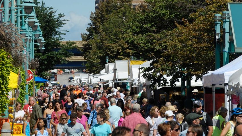 Attendees at the Third Ward Art Festival in Milwaukee's Historic Third Ward, one block from I-794 and Highway 32.