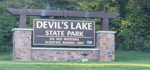 Devil's Lake State Park welcome sign at the eastern and southern end of Highway 136 just south of Baraboo, Wisconsin
